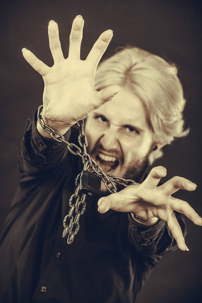 Screaming man with chained hands, no freedom - Photo, Image