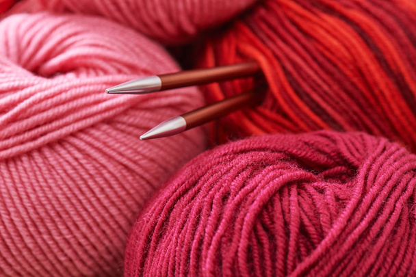 Pile skeins of yarn and knitting needles - Φωτογραφία, εικόνα