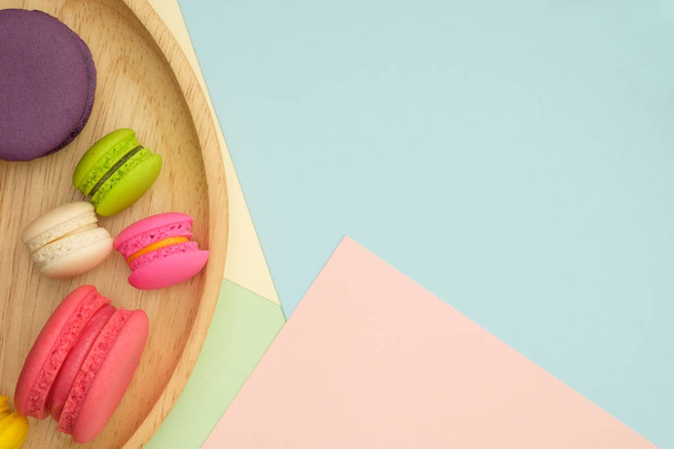 Set of different colorful macaroons Placed in a wooden tray - Фото, изображение