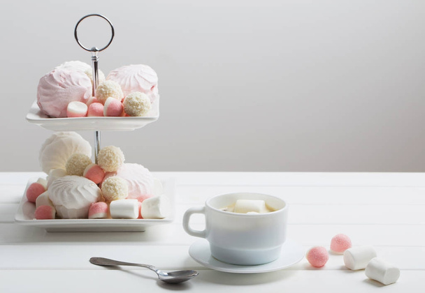 Sweets and a cup of cocoa with marshmallow - Фото, зображення