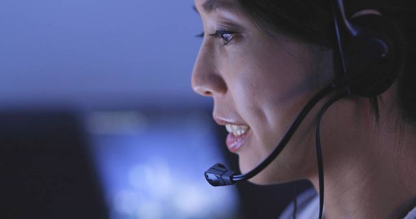 Woman customer services working at night, 24 hour working concept  - Foto, Bild