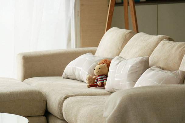 knitting doll on sofa - Foto, afbeelding