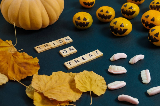 Trick or Treat  Halloween with fake pumpkins and tangerines with - Foto, Imagen