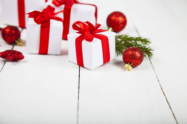 Gifts with red bows and Christmas decorations   - Photo, Image