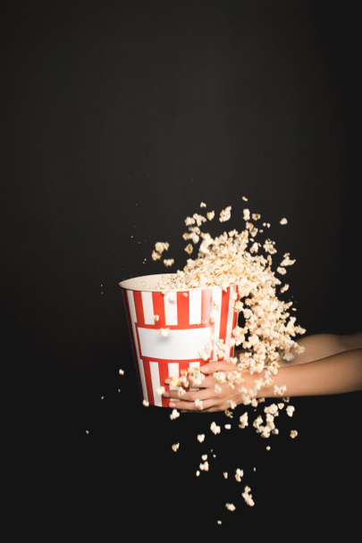 woman holding bucket of popcorn - Photo, Image