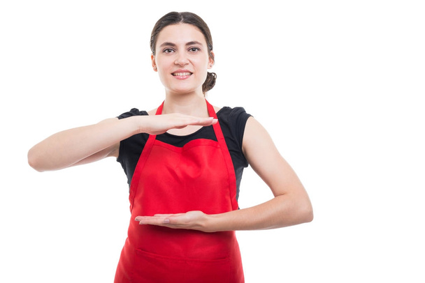 Sales woman showing something invisible in hands - Photo, Image