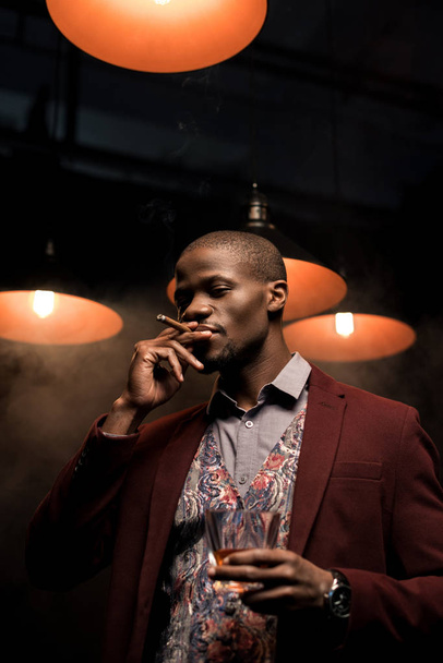 man with whiskey smoking cigar - Zdjęcie, obraz