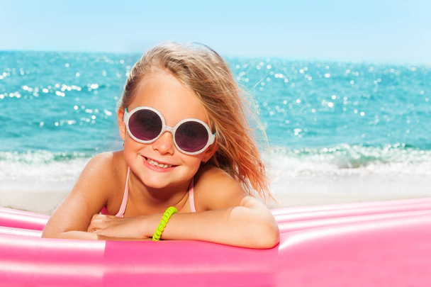 girl sunbathing on beach - Фото, изображение