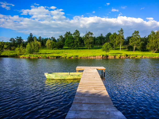 Предпосылки / контекст with lake and fishing place in the summer season
 - Фото, изображение