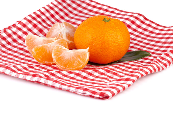 Tangerines on red-white tablecloth - Photo, Image