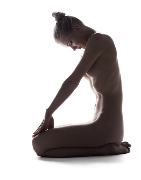 Nude young woman in studio - Foto, imagen
