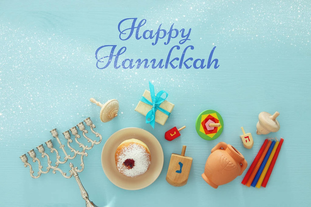 Top view image of jewish holiday Hanukkah background with traditional spinnig top, menorah (traditional candelabra) - Φωτογραφία, εικόνα