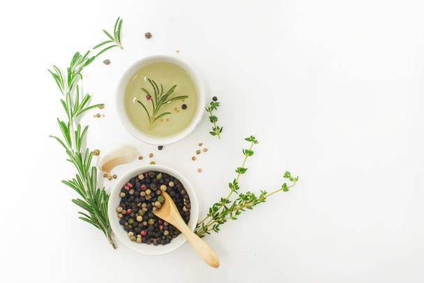 Spices, oil and herbs on white background - Valokuva, kuva