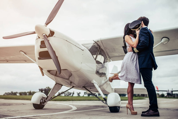Couple near plane - Фото, зображення