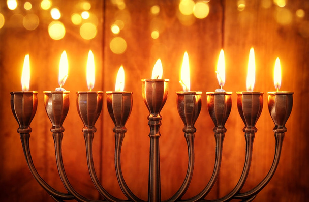 jewish holiday Hanukkah background with menorah (traditional candelabra) and burning candles - Фото, изображение