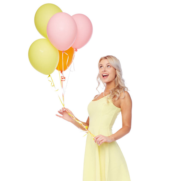 happy woman in dress with helium air balloons - Zdjęcie, obraz