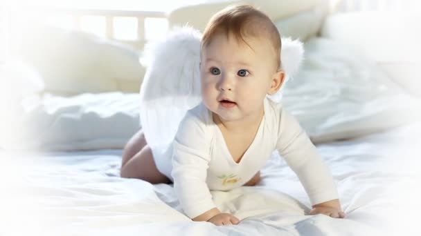 Baby angel on the bed - Filmati, video