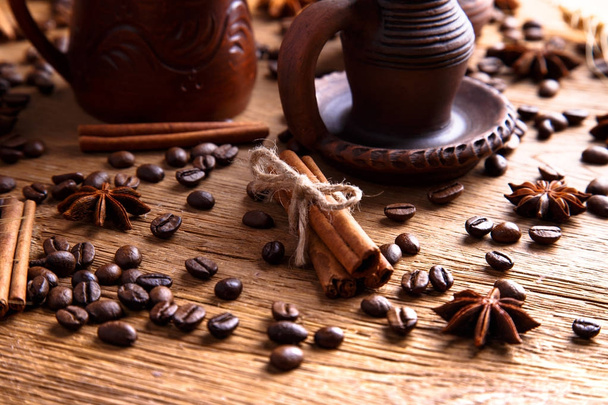grains of black coffee on the wooden table - Φωτογραφία, εικόνα