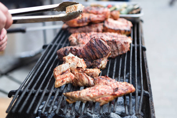 Pork ribs cooking on grill at bbq party - Photo, Image