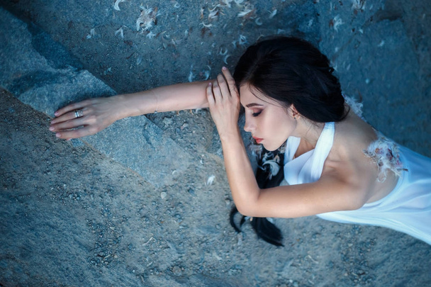 Fallen Angel. A girl with torn off wings - Photo, image
