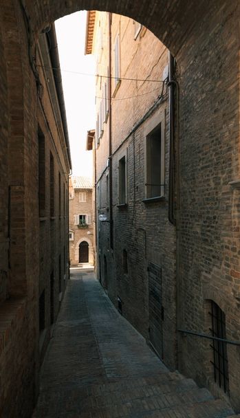Urbino, Italy - August 9, 2017: A small street in the old town of Urbino. sunny day. - Photo, image