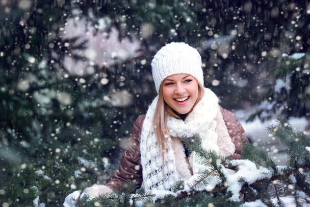 Happy woman under snowfall - Фото, изображение