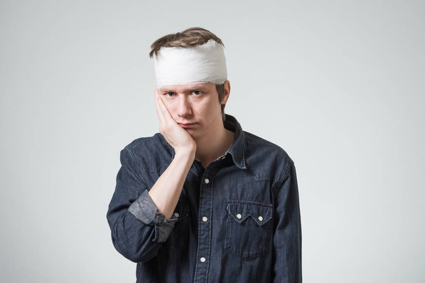 Man with bandage on his head - Фото, изображение