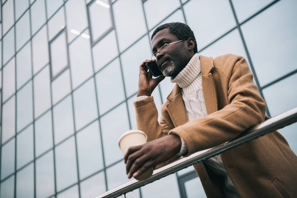 African american man talking by smartphone - 写真・画像
