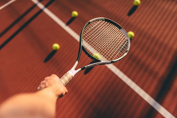 Balls and racket on tennis court - Фото, зображення