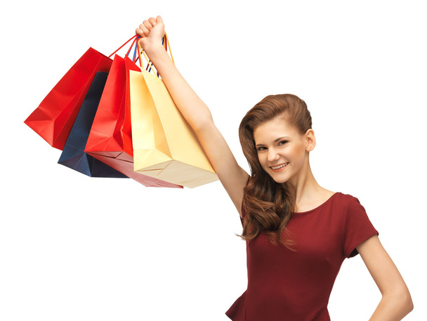 Happy teenage girl with shopping bags - Photo, Image