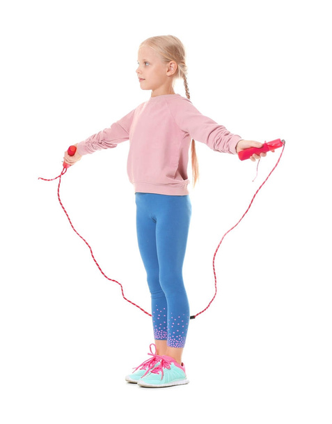 Adorable girl skipping rope, isolated on white - Fotó, kép