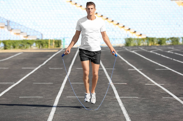 Young man skipping rope  - Foto, Imagen