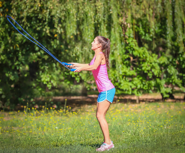 Young woman skipping rope  - Valokuva, kuva