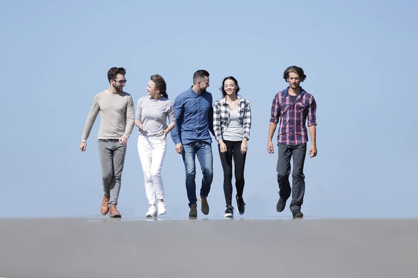 team of young people walking along the road.outdoors - Photo, image