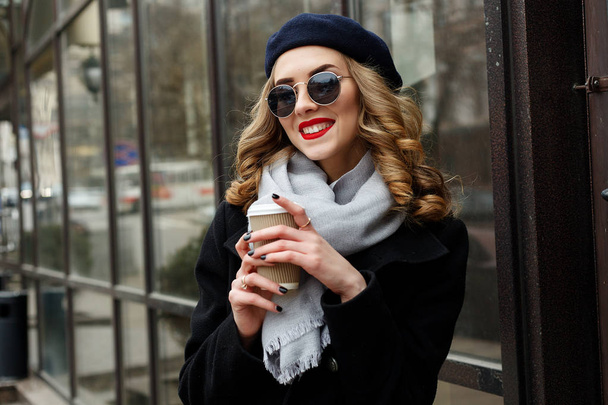 Street photo of young beautiful woman wearing stylish classic clothes. - Photo, Image