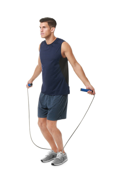 Young man skipping rope - Foto, afbeelding