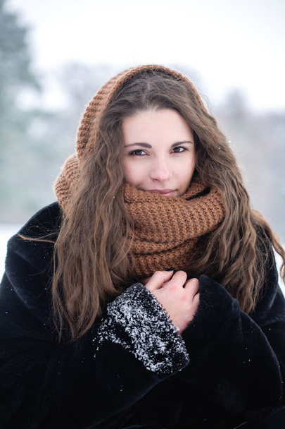 Woman in a scarf - Фото, изображение