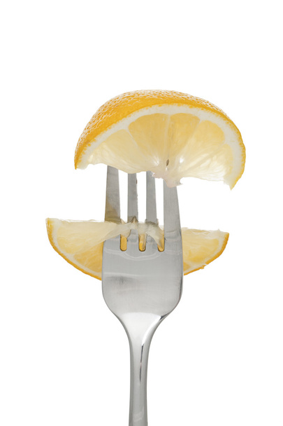 fork with orange fruit slices - Фото, зображення
