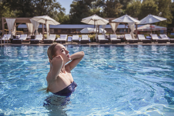 Girl at the pool - Фото, изображение