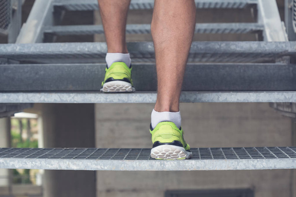 Close up of man legs with sneakers running up the stairs. Sport, - Foto, afbeelding