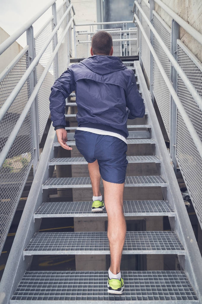 Jogger running up on stairs - Photo, Image
