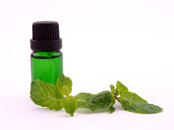 peppermint aroma oil close up on white background ; spa concept - 写真・画像