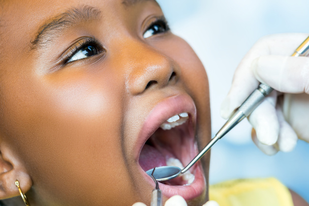 African youngster at dental checkup. - Fotó, kép