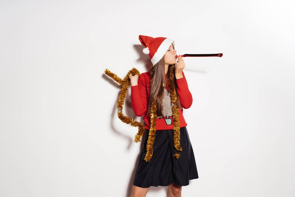 Happy girl in a New Year costume on a white background - 写真・画像