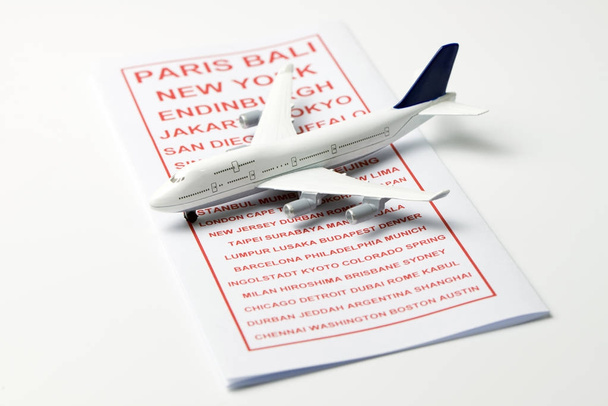 Travel brochure with a model airplane - Photo, Image