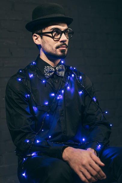 fashionable man with christmas lights - Photo, Image