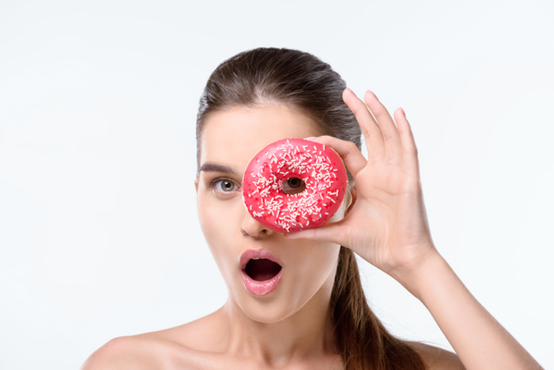 woman holding donut - Фото, изображение