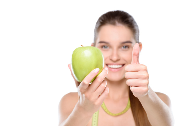 młoda kobieta z jabłkiem - Zdjęcie, obraz