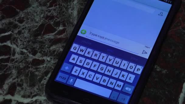 Close up of female hand typing message on smartphone device - Footage, Video