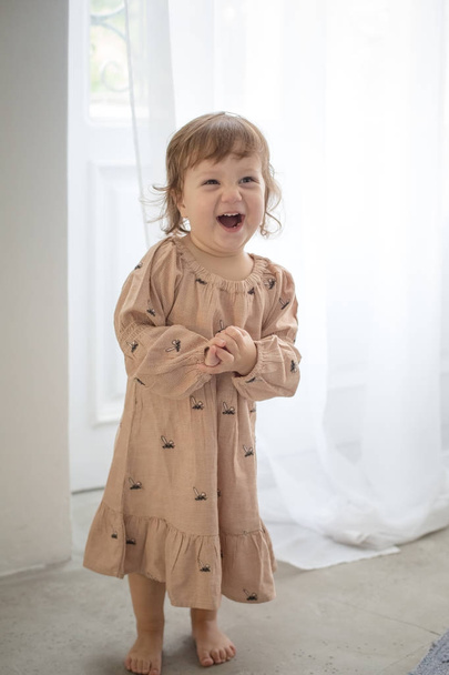Portrait of happy little girl on gray background. - Foto, Imagem